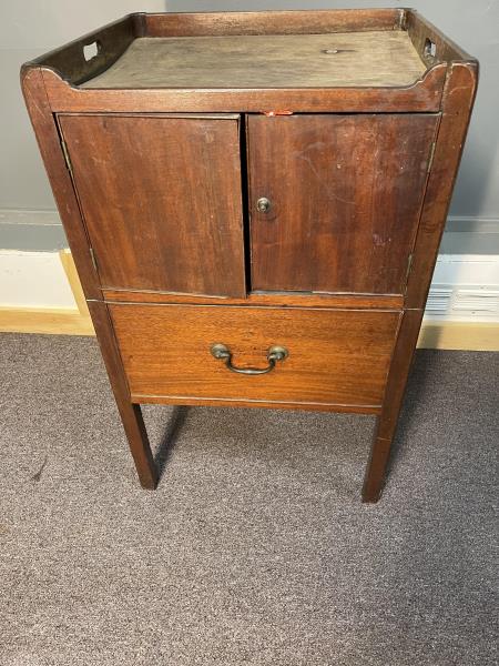 Wash Stand, commode, mahogany, cut out handles, double: mahogany, cut out handles, double door, lower fake drawer, crack and separation, warped top, bottom has hole cut out, poor condition, 33" x 20 1/2" w x 18 1/2" deep