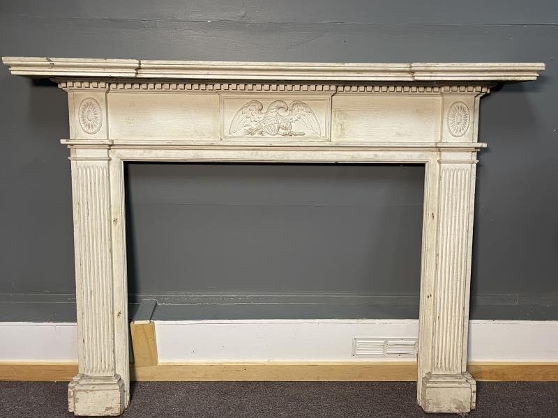 Fireplace Mantle with Carved Eagle old white paint is: old white paint is flaking and peelig off, reeded front columns, eagle on centre and oval rosette on corners, screw holes on outer edge and also inner edges, scratched, Overall 50" t x 70" x 8 1/2"eag