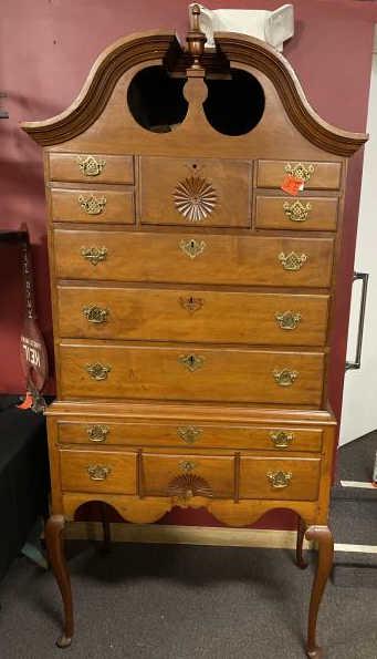 Queen Anne Highboy, 12 drawers, bonnet top, 3 finials: 12 drawers, bonnet top, 3 finials and 2 square blocks, sunburst on top drawer and fan on lower drawer, 2 leg scrolled corners off, right rear leg repaired, drawer front replaced brasses and missing 2 