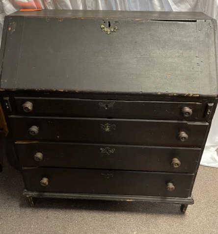 Country Desk, Slant Front, black paint 4 Graduated: 4 Graduated Drawers, wooden round pulls, applied lower molding, 6 drawer step up interior, top split & stained, missing 1 brass, lid damaged and split, drawer missing edges, overall condition poor, 40