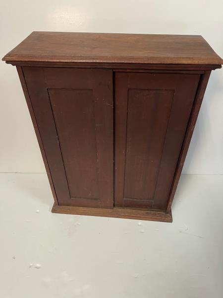 Country Cupboard, sliding, 2 drawer Paneled front door,: Paneled front door, 39 slotted pigeon hole interioroverall: 24"x31"Top & bottom: 2'x10"Top & bottom have approx 1" overhang therefore sliding doors measure: 22"x27.5"