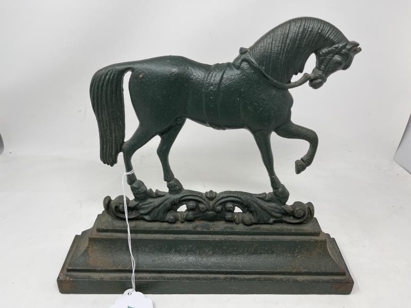 Lot of (2) Door Stops, cast iron, prancing horse &: Horse is painted green (repainted) pitted, 11 1/2" tall x 12 1/2 x 2"; Sheep paint worn, corner gouge & rusted, 7 1/2" tall x 10" x 1 1/2" deep