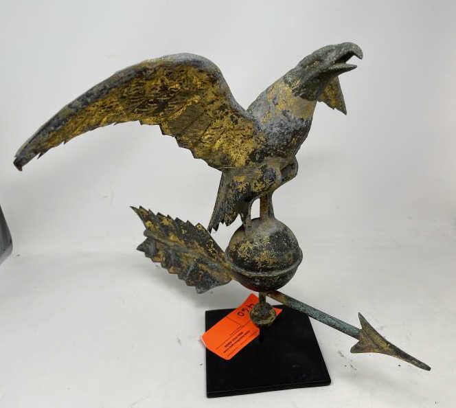 Weathervane, Eagle on Ball with arrow Some old gilding: Some old gilding still present, ball dented with some feathers bent, arrow with hole, 13" tall x 15" wind span, on stand