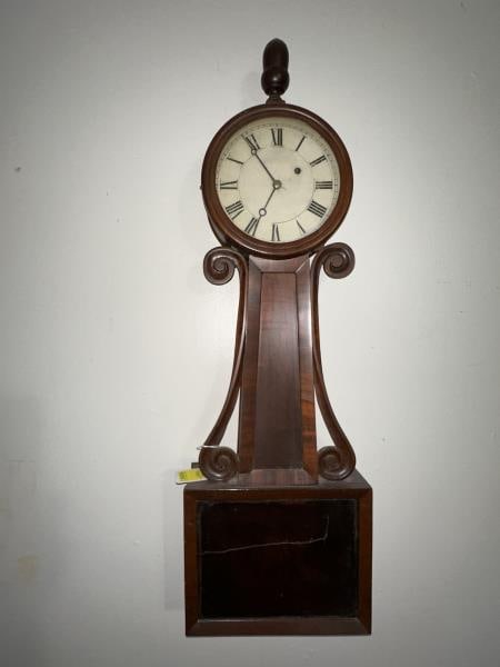Banjo Clock, Mahogany , pine back, veneer damage: Banjo Clock, Mahogany , pine back, veneer damage - lifting & missing, lower door damaged - scratched and split, no maker, acorn finial, wt. & pendulum, no key, old label on inside of door, 32.5" tall