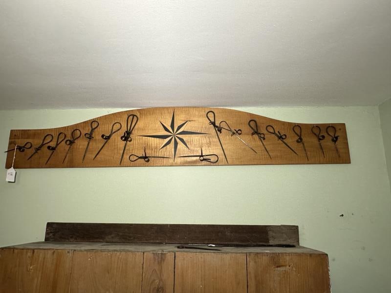 Collection of Miners Candle Lights (16): Collection of Miners Candle Lights (16), wrought iron, mounted on a board with inlay star decoration, board 13"Tx72"W