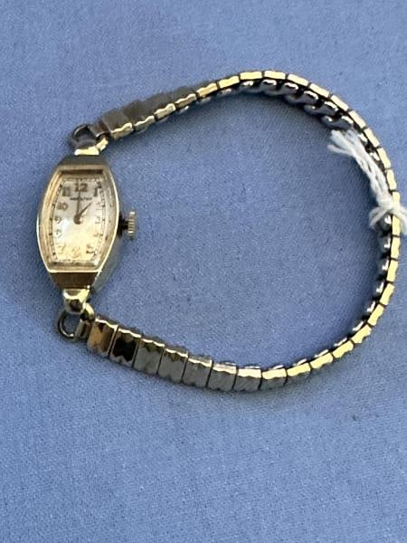 Hamilton 14K Gold Ladies Wrist Watch, gold filled: Hamilton 14K Gold Ladies Wrist Watch, gold filled band, not workingUnless You Are A Liveauctioneers Premium Bidder This Lot Must Be Paid For By Cash, Bank Check or Wire Transfer.