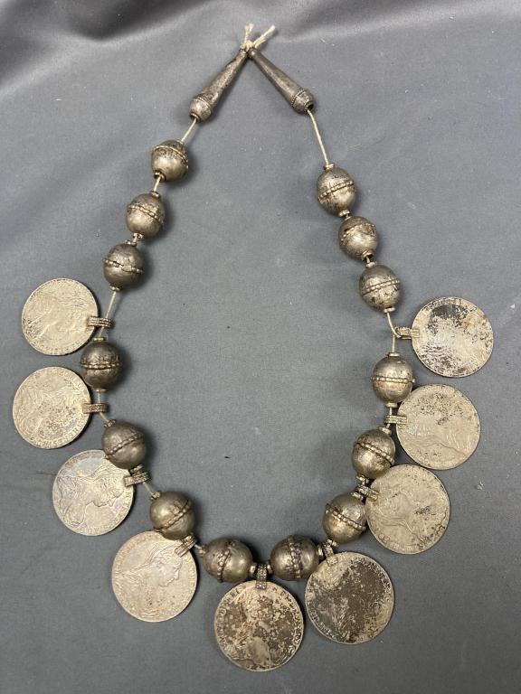 Antique Silver Maria Theresa Thaler Necklace: Necklace made from nine thalers from 1780, the 35th year of her reign. The Maria Theresa thaler (MTT) is named after Empress Maria Theresa, who ruled Austria, Hungary and Bohemia from 1740 to 1780 and