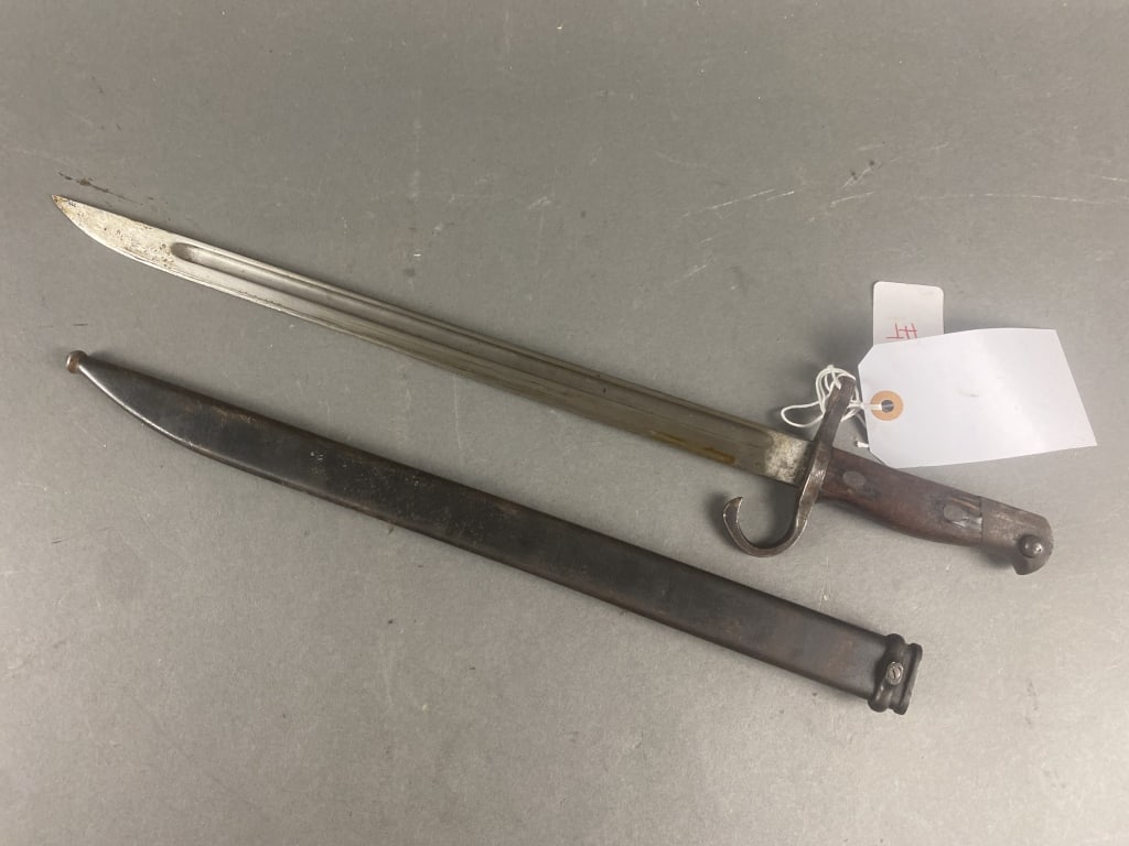 WWII Japanese Type 30 Bayonet: Bright blade/Blued scabbard 80% finish scabbard. Very good condition. Some minor losses to wood grips. Dulled finish to blade. Serial number-1853003