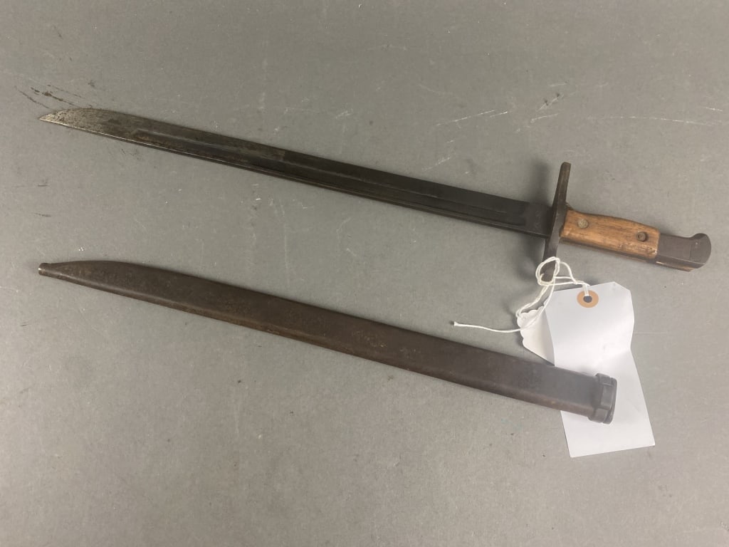 WWI Japanese Type 30 Bayonet Kokura Hourglass: Blue blade and scabbard 80% finish. Very good condition. Mid war straight crossguard