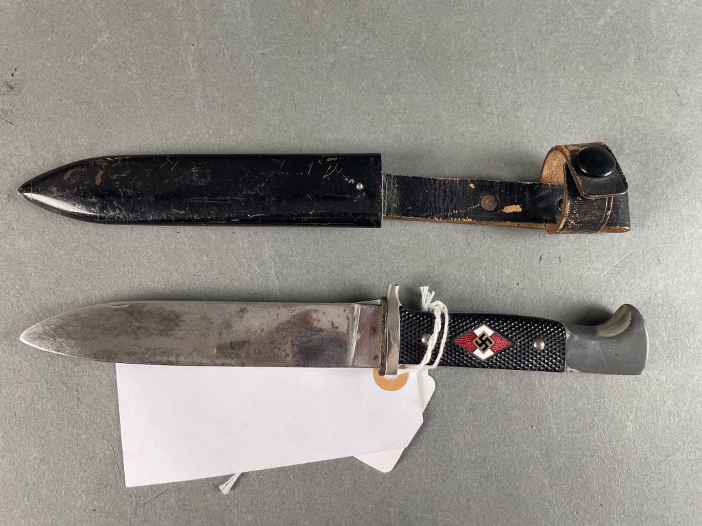 WWII German Hitler Youth Knife- RZM, M7/13: Plated 80% finish. Good condition. Broken crossguard. Plating loss to hilt. Solid scabbard with retaining strap.