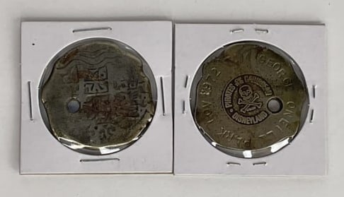 (2) Vintage PIRATES of the CARIBBEAN Novelty PIECES OF EIGHT Engraved 1970's: So a long time ago (I believe 1970's) when exiting the Pirates of Caribbean you could get a NOVELTY Piece of Eight and have it engraved, This auction is for (2) of them. The FIRST one has engraved "WE