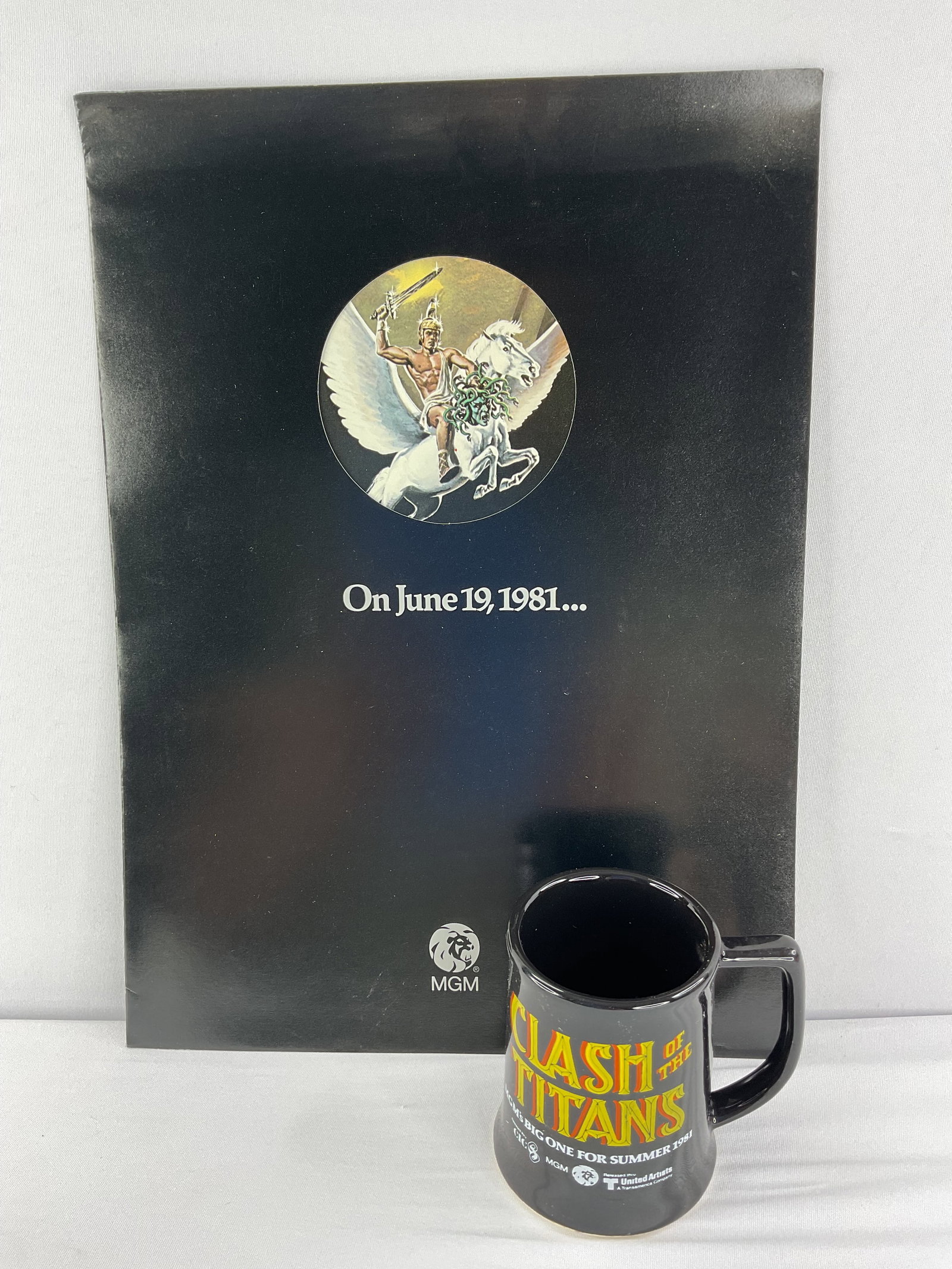 CLASH OF THE TITANS (1981) MUG and Movie Release Booklet MGM: CLASH OF THE TITANS (1981) MUG and Movie Release Booklet MGM. A rare pre release coffee mug and a pre release movie MGM hype booklet. The mug measures: 4" Tall and 4.5" Wide. The Booklet measures: 15"