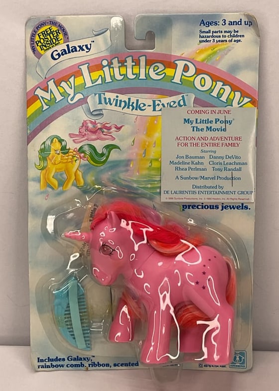 MY LITTLE PONY The Movie Twinkle Eyed Pony PROMO: A MY LITTLE PONY Movie Promotional Item. The movie distributed by De Laurentis Entertainment Group. The toy has a movie details stapled to the toy.