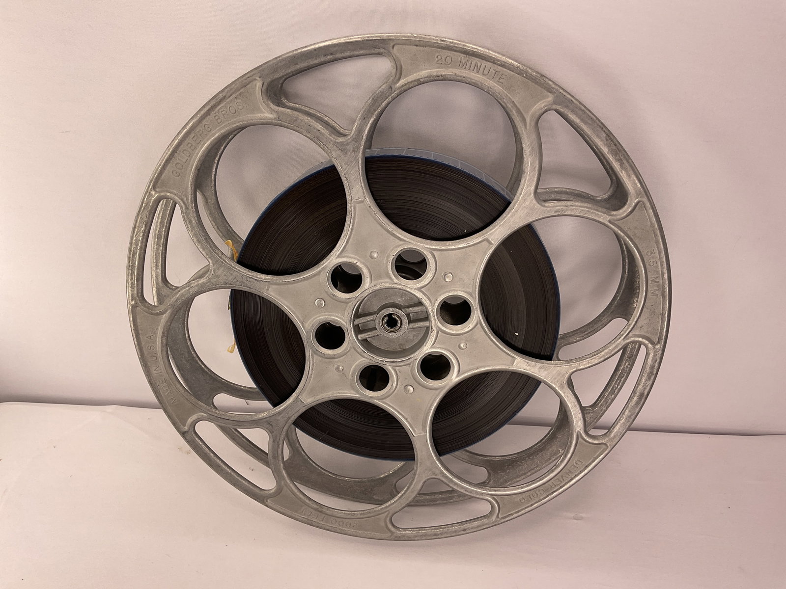 Vintage GOLDBERG BROS 6 Hole Metal Film Reel 35mm with FILM: Vintage GOLDBERG BROS 6 Hole Metal Film Reel 35mm with FILM. This is the second Goldberg Bros Film Reel and this one appears to be a little newer version than #31. Whether you use this vintage item or