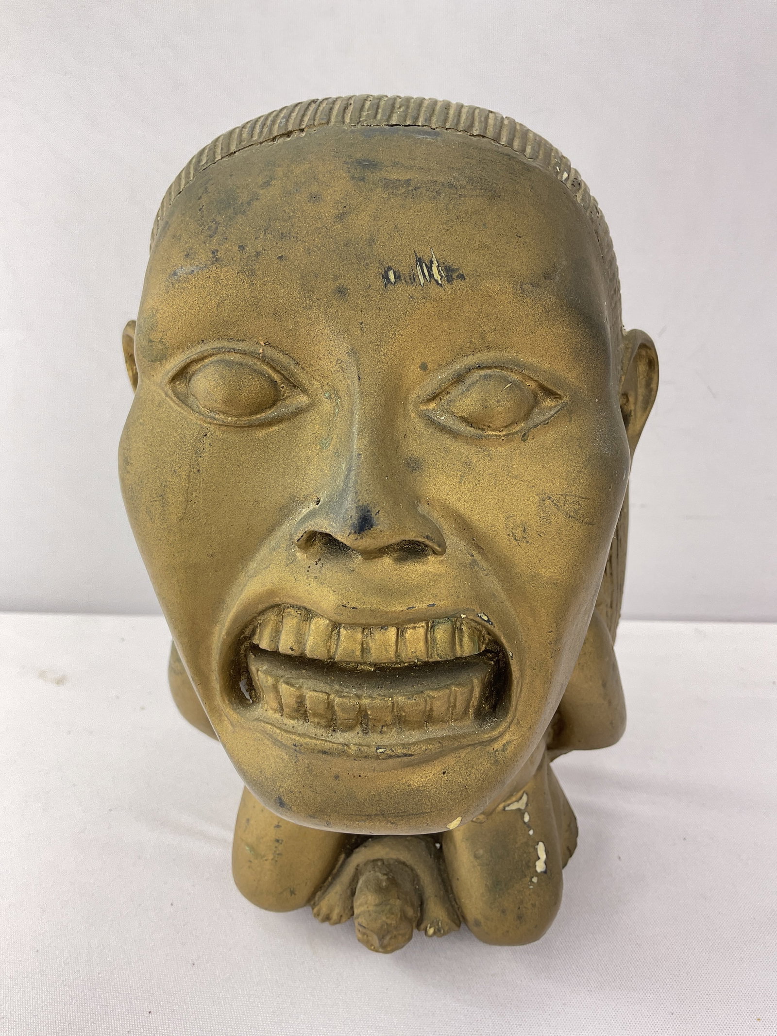 "The Idol" from INDIANA JONES Raiders of the Lost Ark Plaster REPLICA: First and foremost whoever wins this piece should figure some way to paint it SHINY gold as it is painted in dull gold, this will make it look much better. The Idol weighs 3lbs 8oz and stands 7 1/2" t