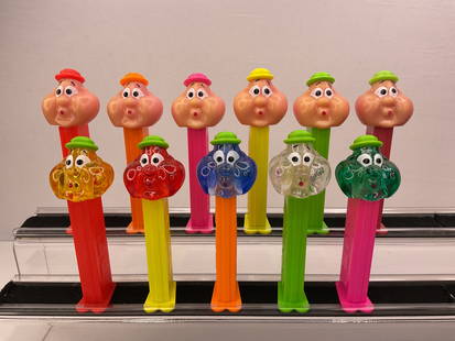 (11) Bubbleman Pez Dispensers (5) with Crystal Heads Footed: (11) Bubbeman Pez Dispensers (5) with Crystal Heads Footed (10) are Made in HUNGARY (1) in SLOVENIA - The Pez with the green hat and slightly cross-eyed is the SLOVENIA made Pez.