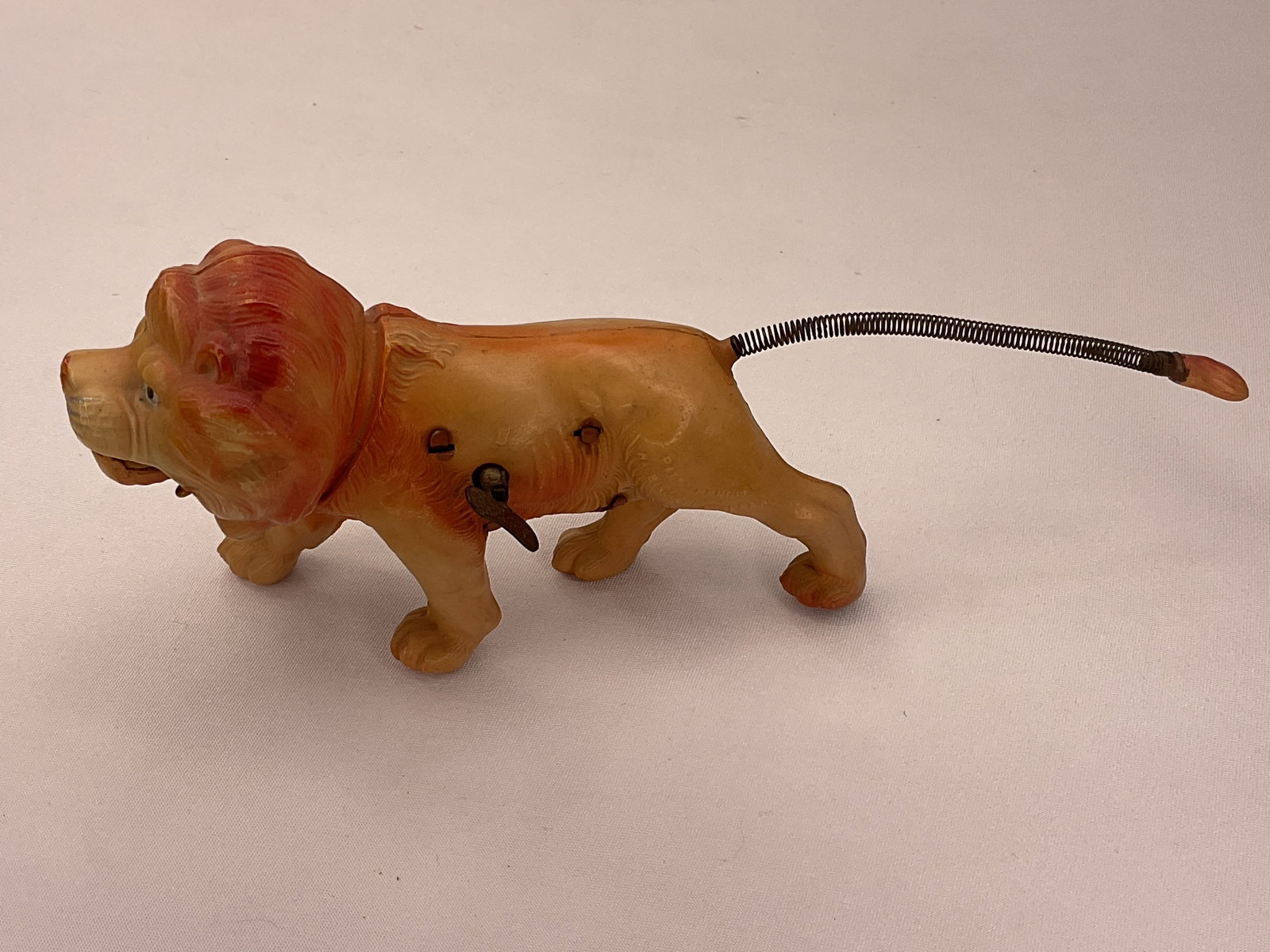 Celluloid CIRCUS LION Windup Toy Occupied Japan wire tail Roars: Celluloid CIRCUS LION Windup Toy Made in Occupied Japan with wire tail mouth moves up and down when wound up giving the impression of ROARING.