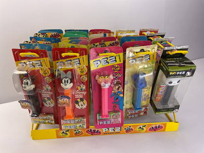 Large Hanging PEZ Display with (29) Unopened Pez and POP Pez Dispensers: Large Hanging PEZ Display with (29) Unopened Pez and POP Pez Dispensers. We will ship this in two different boxes - one with just the display and one with the Pez and POP Pez dispensers.