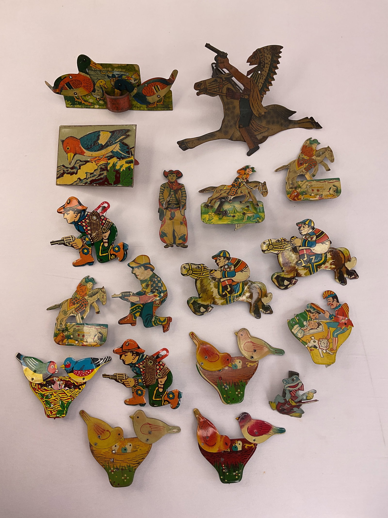 Collection of (18) Vintage Advertising Clickers Noise Makers COWBOYS Indian JOCKEYS Birds: Collection of (18) Vintage Advertising Clickers Noise Makers including: Cowboys, an Indian, Jockeys, Birds, Frog and more.