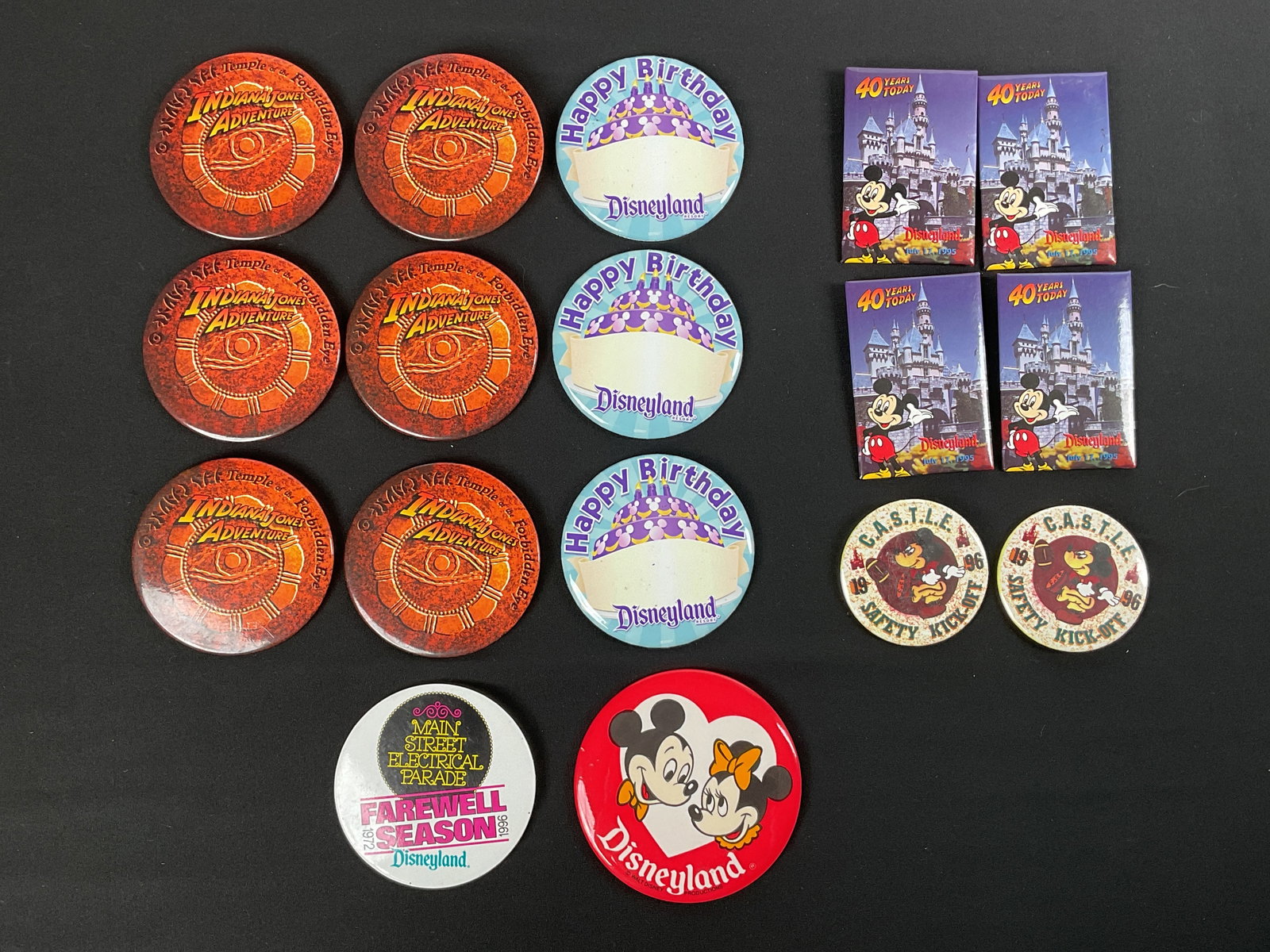 90's Disney Buttons: 17 buttons total Including -x4 1995 40 year anniversary pins x2 1996 C.A.S.T.L.E. safety kick-offx6 Indiana Jones Adventure Temple of the Forbidden Eyex1 Mainstreet Electrical Parade 1972 -1996 Farewe