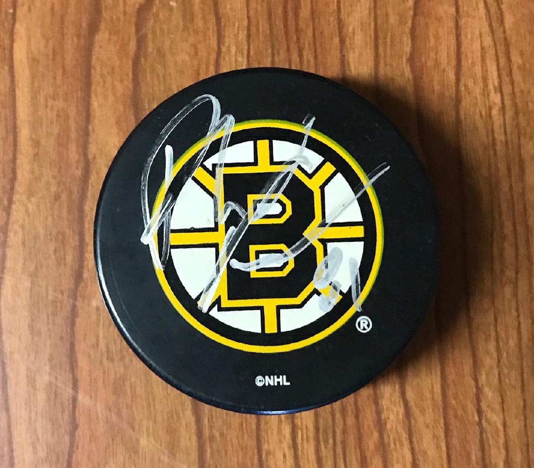 Hockey Puck Autographed by Phil Kessel - Boston Bruins: Phil Kessel Boston Bruins signed hockey puck. Phil Kessel played with the Boston Bruins from 2001 to 2009