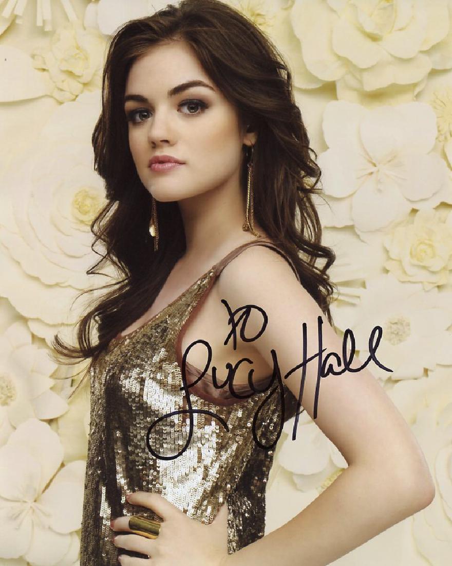 Lucy Hale PRETTY LITTLE LIARS In Person Signed Photo: Lucy Hale in person signed autographed photo from the TV series PRETTY LITTLE LIARS. Lucy Hale as the character Aria Montgomery. Photo sizes 8 x 10