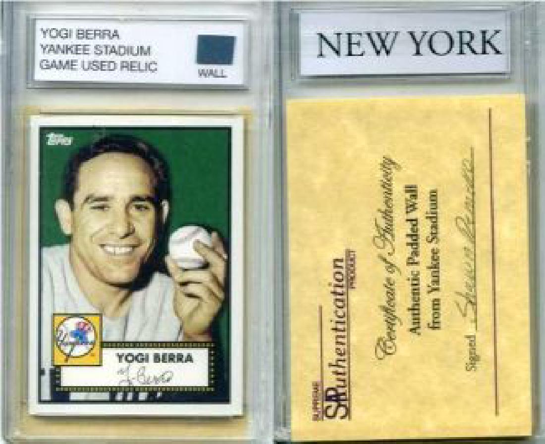 Yogi Berra Yankee Stadium Game Used Relic: This is an awesome Piece of history starting with an amazing reprint of Yogi Berra 1952 Topps card with a piece of padded wall from the old Yankee Stadium. The encased collectible comes complete with 