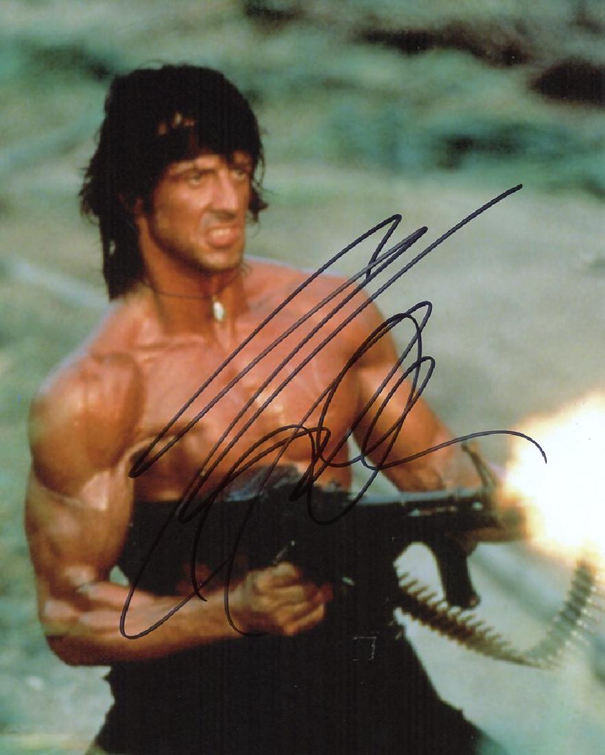 Sylvester Stallone RAMBO In Person Signed Photo #2: Sylvester Stallone in person signed photo from the movie RAMBO. Sylvester Stallone as the character RAMBO. Photo size is 8x10.