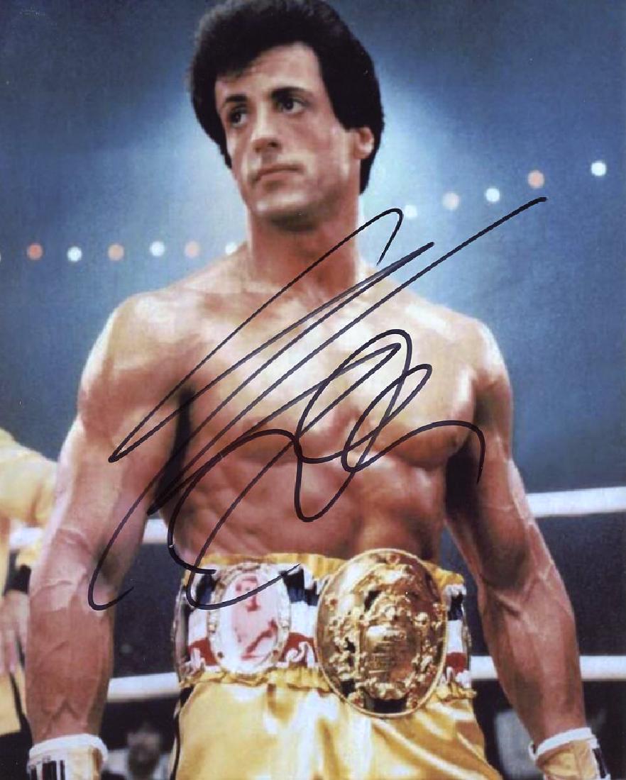 Sylvester Stallone ROCKY 2 In Person Signed Photo: Sylvester Stallone in person signed autographed photo from the movie ROCKY 2. Sylvester Stallone as the character Rocky. Date & Signing location provided. Photo size is 8x10