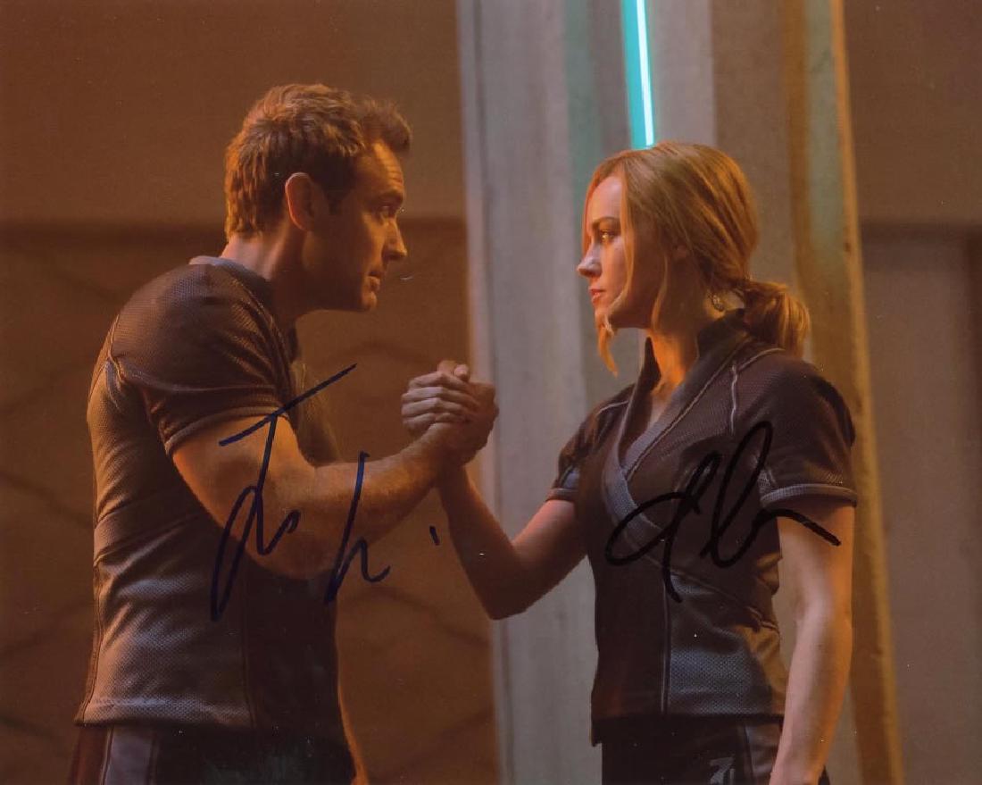 Brie Larson / Jude Law CAPTAIN MARVEL In Person Signed: Brie Larson / Jude Law in person signed autographed photo from the movie CAPT. MARVEL. Brie Larson as the character Carol Danvers - CAPT MARVEL. Jude law as the character Yon-Rogg. Photo size is 8x10