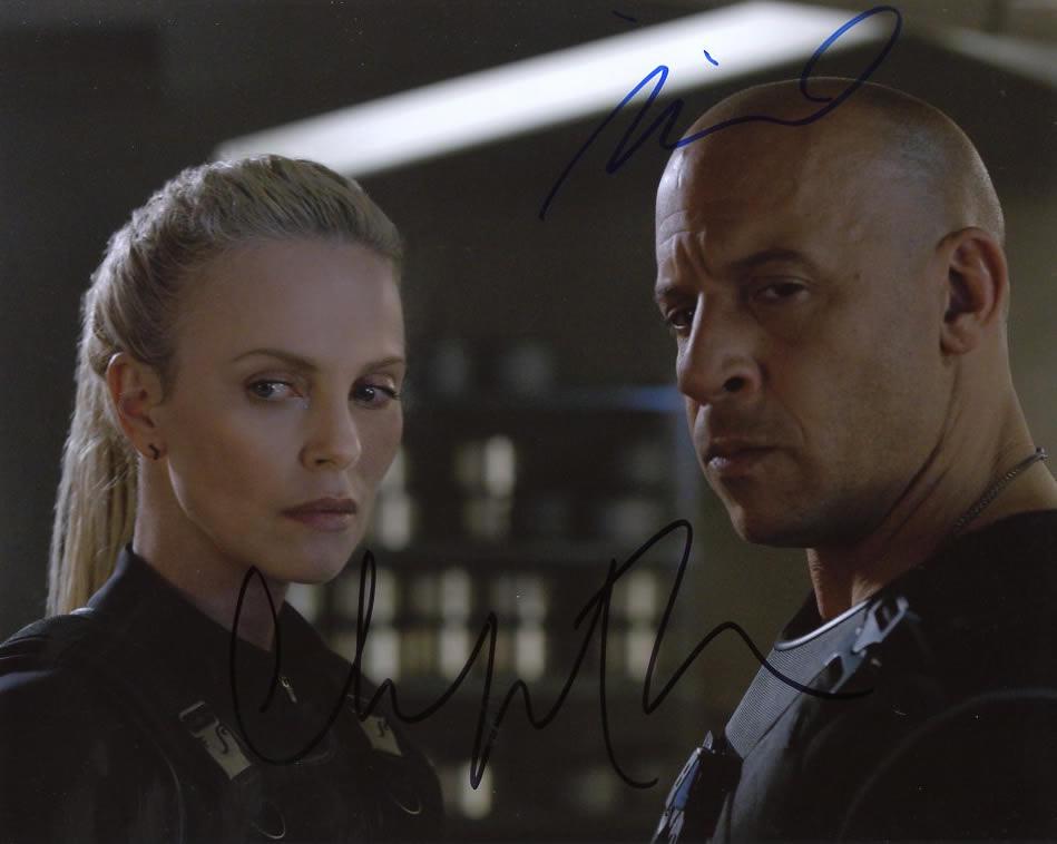 Vin Diesel / Charlize Theron FATE OF THE FURIOUS In: Vin Diesel / Charlize Theron in person signed autographed photo from the movie THE FATE OF THE FURIOUS. Vin Diesel as the character Dom . Charlize Theron as the character Cipher. Photo size is 8 x 10