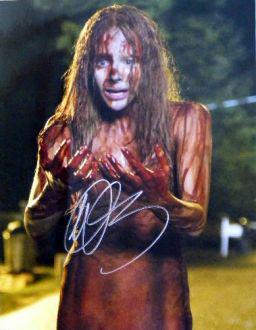 Chloe Grace Moretz CARRIE 11x14 Signed Photo: Super in person signed photo from the movie CARRIE. This is 11x14 in size. Perfect from framing and showing off on your wall.