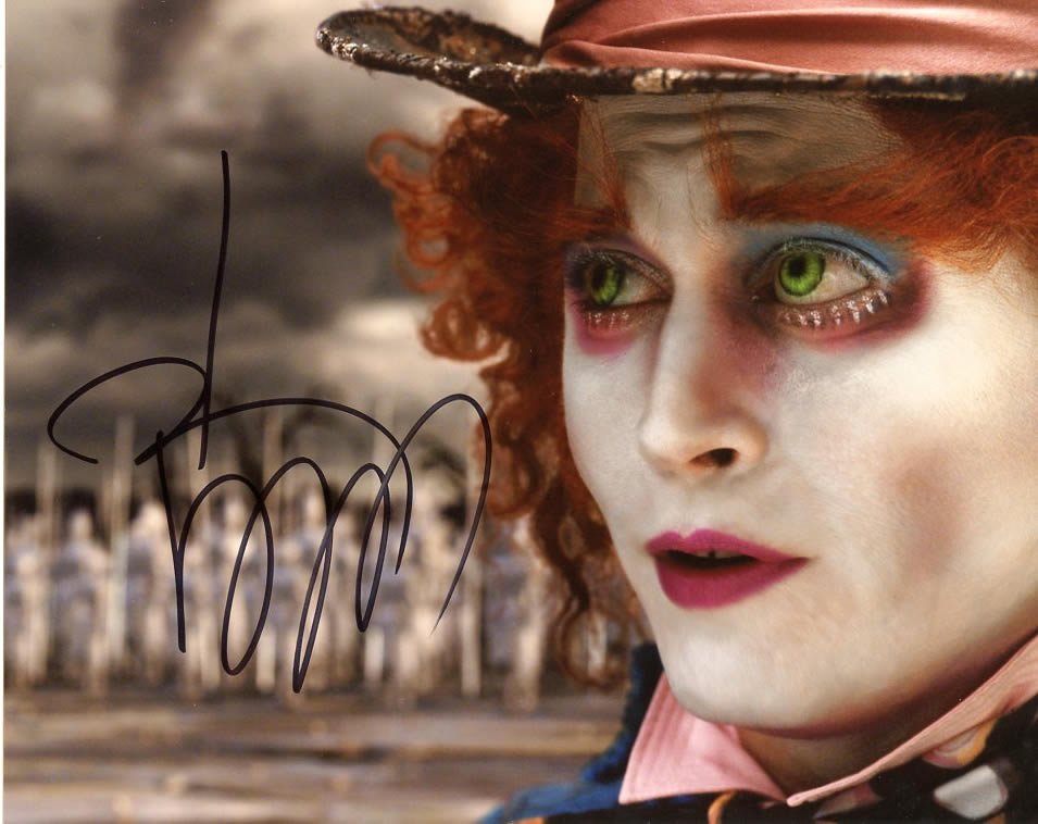 Johnny Depp ALICE IN WONDERLAND In Person Signed: Johnny Depp in person signed autographed photo from the movie ALICE IN WONDERLAND. Johnny Depp as the character Mad Hatter. Date & signing location provided.