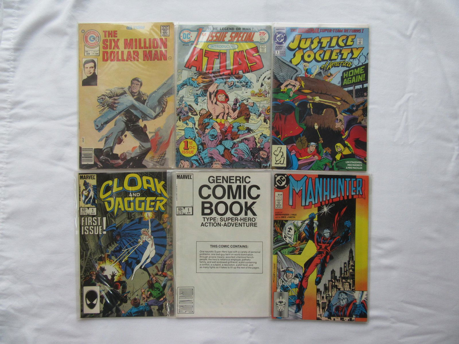 Comic Books (5) Issue number 1: The 5 comics in this lot are all #1's. These are from my personal collection. You are getting Six Million Dollar Man 1976, Atlas 1975 (Jack Kirby art work), Justice Society of America 1992, Cloak & Da