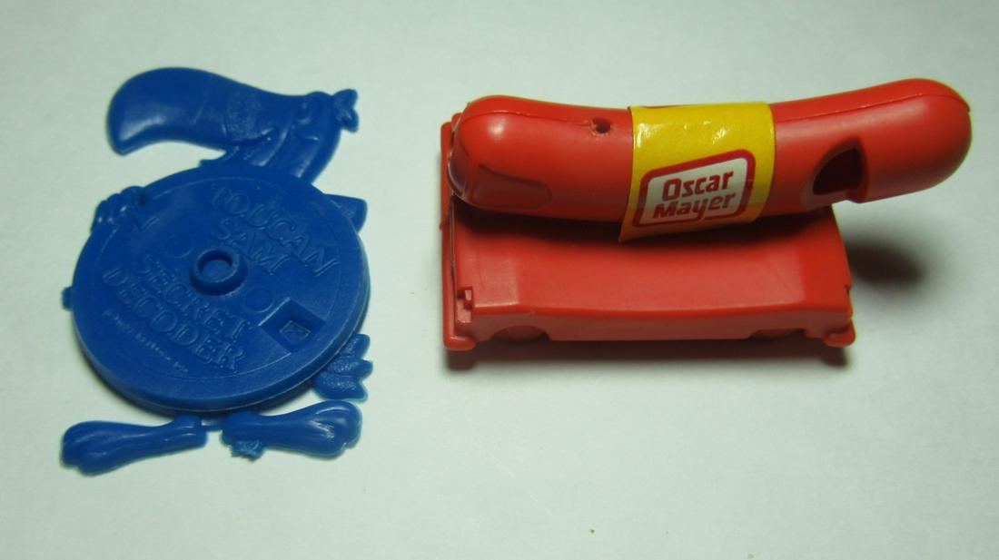 VINTAGE Tucan Sam Secret Decoder / Oscar Mayer Weiner: Late 60's early 70's is this Oscar Meyer wiener whistle in excellent condition. Next, is this 1988 Toucan Sam Secret Decoder. Which was a serial premium that came out of. Fruit Loops. Both in excellen