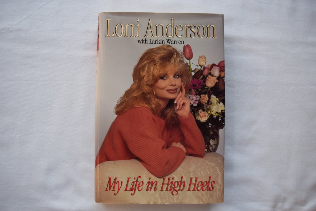 Signed Loni Anderson "My Life In High Heels" Book: The signature in this book was obtained in person by myself. Hardcover 1995. The actress breaks her silence about her marriage to and divorce from Burt Reynolds, recounting her struggle to keep her fa