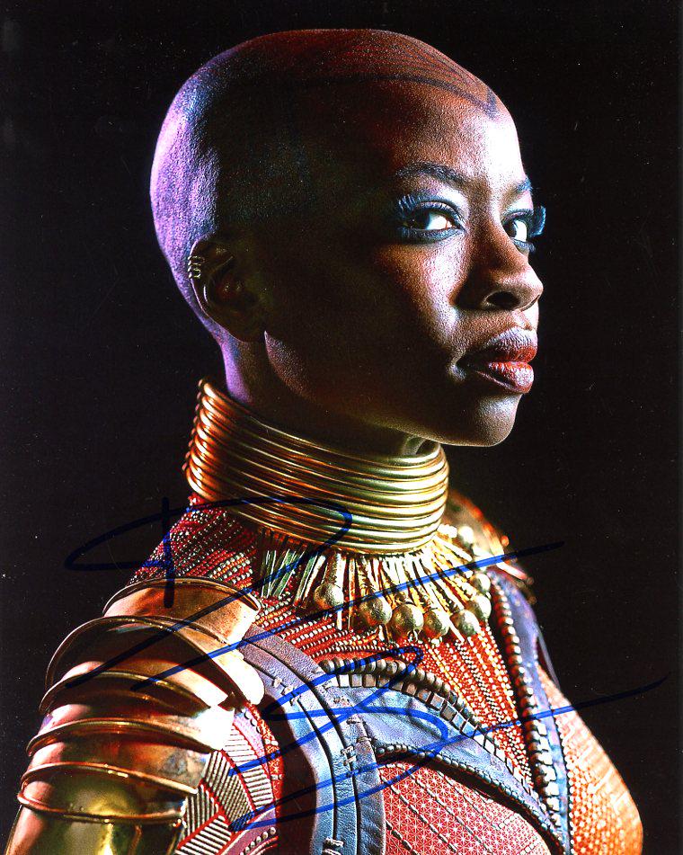 Danai Gurira BLACK PANTHER In Person Signed Photo: Danai Gurira in person signed autographed photo from the movie BLACK PANTHER. Danai Gurira as the character Okoye