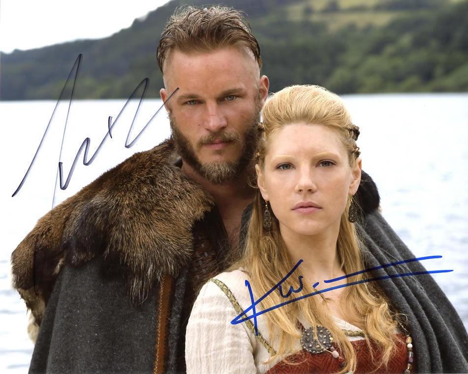 Travis Fimmel / Katheryn Winnick VIKINGS In Person: Travis Fimmel / Katheryn Winnick in person signed autographed photo from the TV series VIKINGS. Travis Fimmel as the character Ragnar Rothbrok. Katheryn Winnick as the character Lagertha