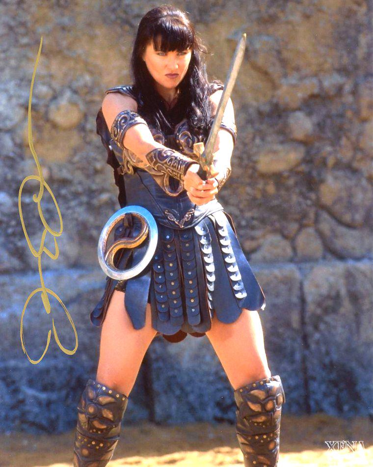 Lucy Lawless XENA In Person Signed Photo: Lucy Lawless in person signed autographed photo from the TV series XENA. Lucy Lawless As the Character XENA.