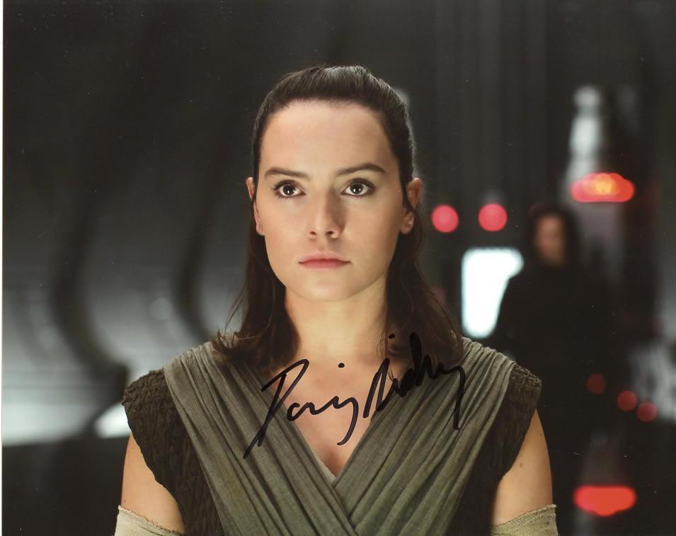 Daisy Ridley STAR WARS THE FORCE AWAKENS In Person: Daisy Ridley in person signed autographed photo from the movie STAR WARS THE FORCE AWAKENS. Daisy Ridley as the character Rey
