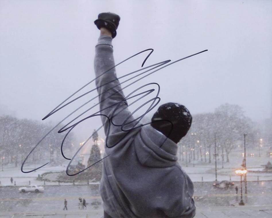 Sylvester Stallone ROCKY In Person Signed Photo: Sylvester Stallone in person signed autographed photo from the movie ROCKY. Sylvester Stallone as the character Rocky