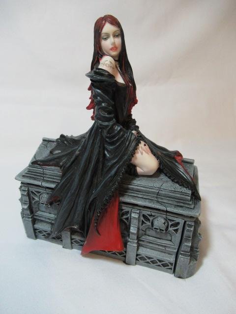 Await the Night Box Trinket Box by Anne Stokes: Measurements: L 6.5 W 3.25 H 7.5. Design by Anne Stokes. Made out of Poly Stone and Hand Painted. Very Detailed and high quality. Nice weight to it.. And gorgeous!