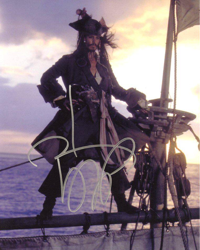 Johnny Depp PIRATES OF THE CARIBBEAN In Person Signed: Johnny Depp in person signed autographed photo from the movie PIRATES OF THE CARIBBEAN. Johnny Depp as the character Jack Sparrow. Photo size is 8 x 10