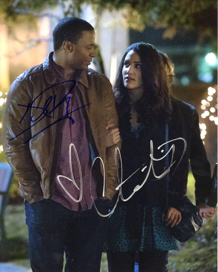 David Ramsey / Christie Liang ARROW In Person Signed: David Ramsey / Christie Liang in person signed autographed photo from the TV series ARROW. David Ramsey as the character John Diggle. Christie Liang as the character Carly Diggle. Photo size is 8 x 10