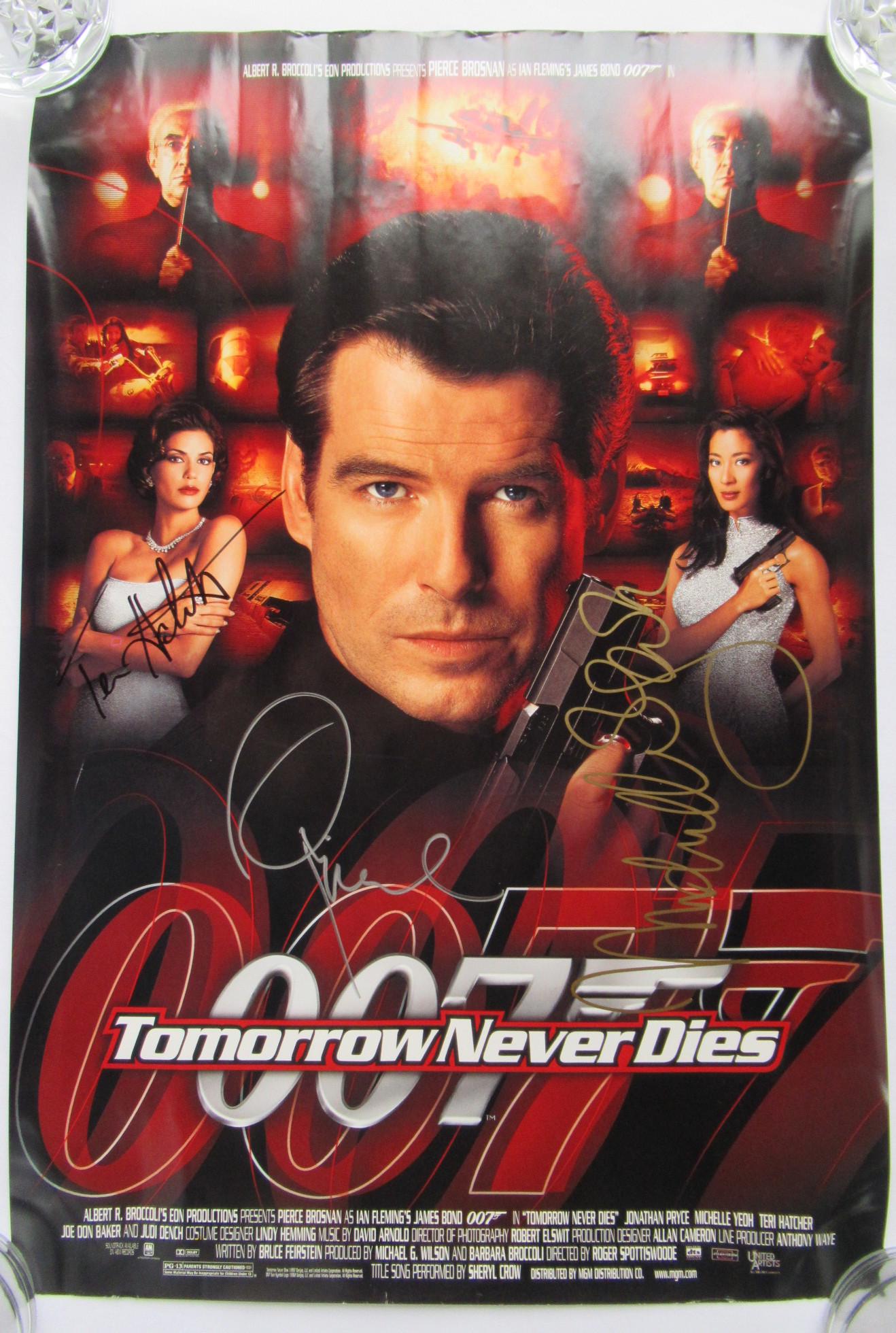 Brosnan / Hatcher / Yeoh SIGNED TOMORROW NEVER DIES: 1997 PIERCE BROSNAN as JAMES BOND in TOMORROW NEVER DIES MOVIE POSTER. This is signed by Pierce Brosnan, Teri Hatcher and Michelle Yeoh. Measures 13.5 x 20 inches, minor edge & corner wear, bright & c