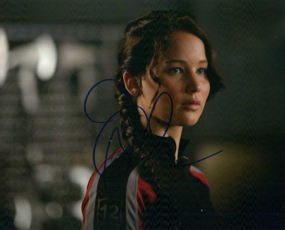 Jennifer Lawrence HUNGER GAMES In Person Signed Photo: Jennifer Lawrence in person signed autographed photo from the movie HUNGER GAMES MOCKINGJAY PT 2. Jennifer Lawrence as the character Katniss Everdeen