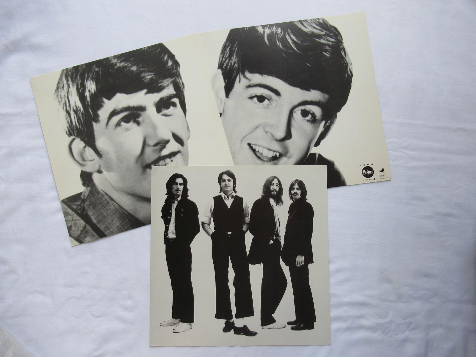 1994 Capitol Records Apple Label Beatles Poster Flats: 1994 Beatles Poster Flats. Listing is for a 1994 Capitol Records Apple Label Beatles Poster flats B&W photos & portraits. Measures 12 x 12 inches, minor edge & corner wear, tiny corner creases at tips