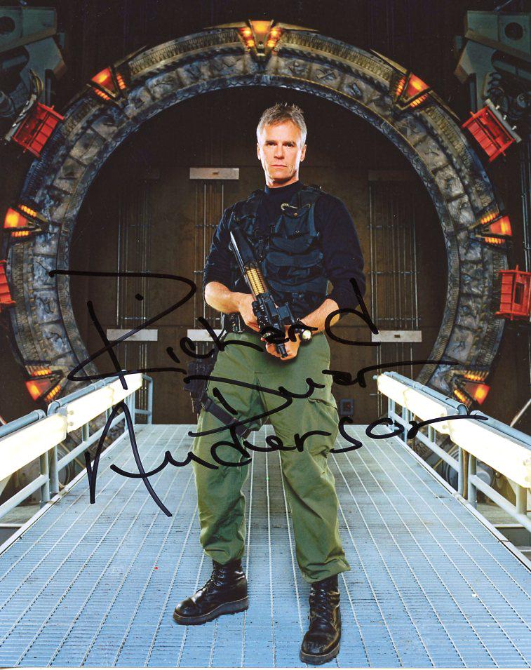 Richard Dean Anderson STARGATE In Person Signed Photo -: This was from a EB Autographs private signing. Richard Dean Anderson in person signed photo from the TV series STARGATE. Richard Dean Anderson as the character Col. Jack O'Neill
