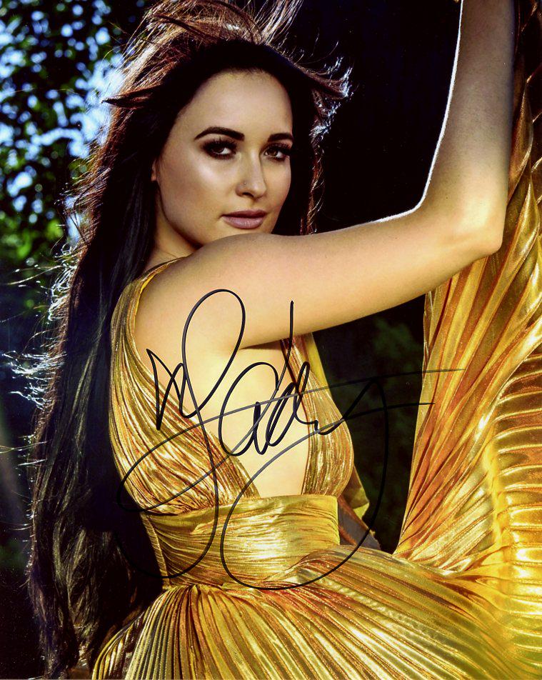 Kacey Musgraves COUNTRY SUPERSTAR In Person Signed: Kacey Musgraves in person signed autographed photo. Kacey Musgraves is an American singer and songwriter. She has won six Grammy Awards, six Country Music Association Awards, and three Academy of Coun