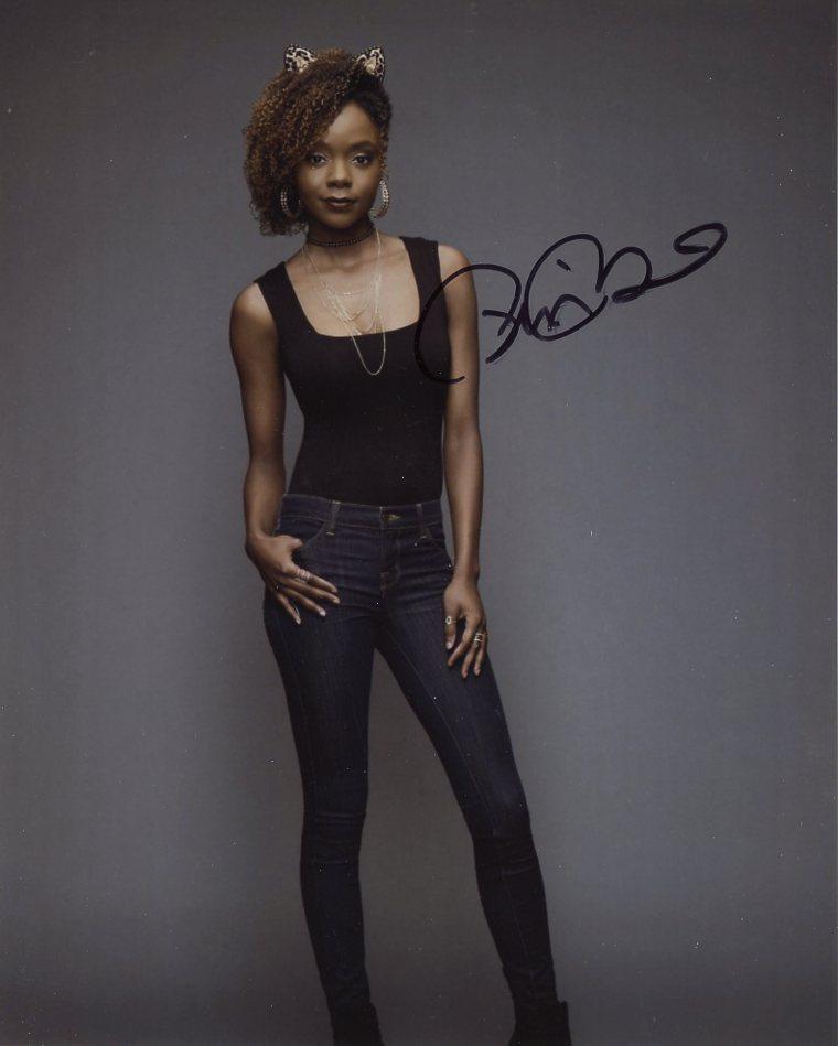 Ashleigh Murray RIVERDALE In Person Signed Photo: Photo size is 8 x 10. Ashleigh Murray in person signed autographed photo from the TV series RIVERDALE. Ashleigh Murray as the character Josie McCoy